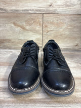 Front view of Steve Madden Toliverr cap-toe oxford toddler shoes size 12C showcasing cap toe, contrast stitched sole and lace-up closure on wood floor