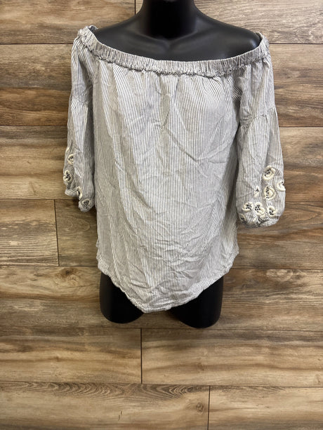 Front view of white striped off-shoulder maternity top with elastic neckline and embroidered sleeve cutouts on mannequin