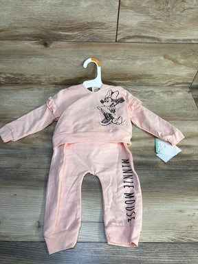 Pink Minnie Mouse baby outfit with ruffle sleeves and matching pants, 12M size on hanger