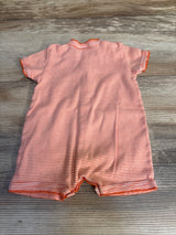 Back view of Petite Bateau orange and white striped short sleeve shortie romper on wood plank floor