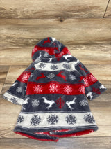 Front view of a plush hooded bath robe with red, navy, white snowflake and reindeer pattern on a wood floor
