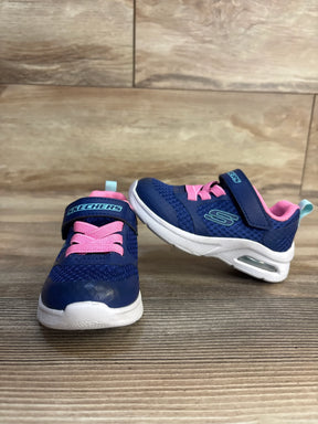 Blue and pink Skechers toddler sneakers with velcro straps and air cushion soles on wood floor