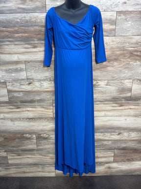 Royal blue long sleeve maxi dress with draped neckline on mannequin against wood panel wall