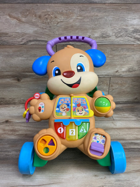 Front view of Fisher Price Laugh and Learn Smart Stages Puppy Walker with numbered buttons on wood flooring
