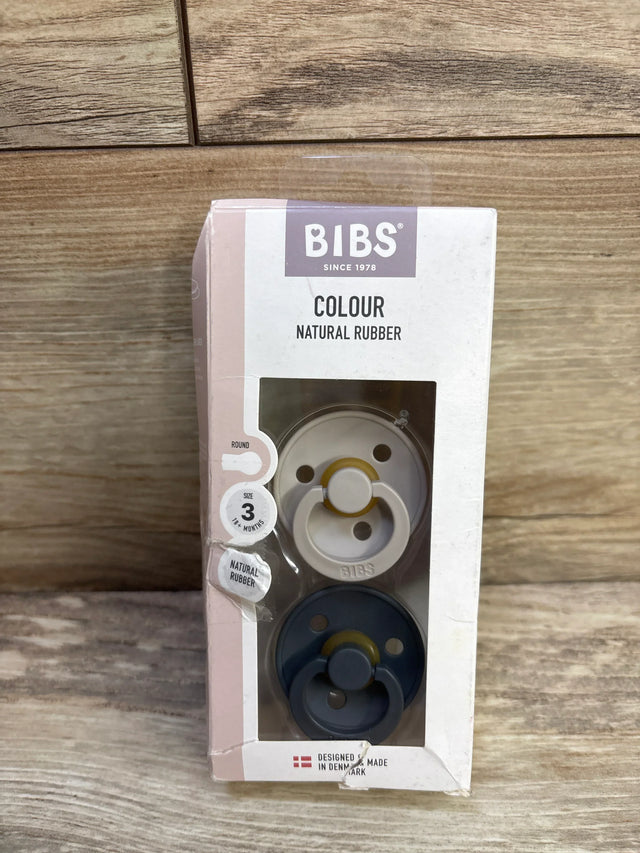 Front view of BIBS Colour natural rubber pacifier 2-pack, size 3 (18+ months), showing sand and iron pacifiers in window box