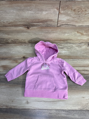 Pink toddler hoodie with Barbie logo and front pocket on wooden floor