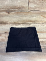Black kids' mini skirt on wood floor, children's clothing resale, gently used apparel