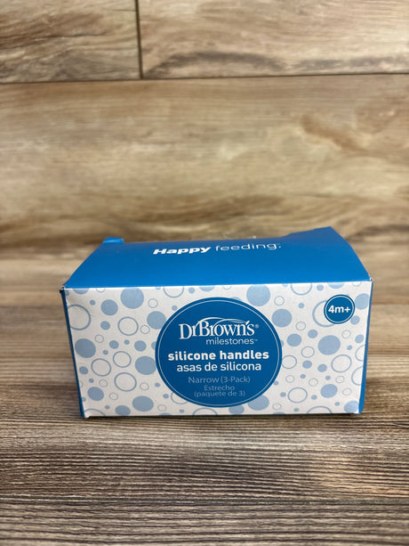 Front view of Dr Browns Milestones silicone narrow handles 3-pack box showcasing brand logo and product text on wood surface