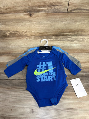 Nike baby bodysuits 3-pack with blue #1 from the start graphic on wood background