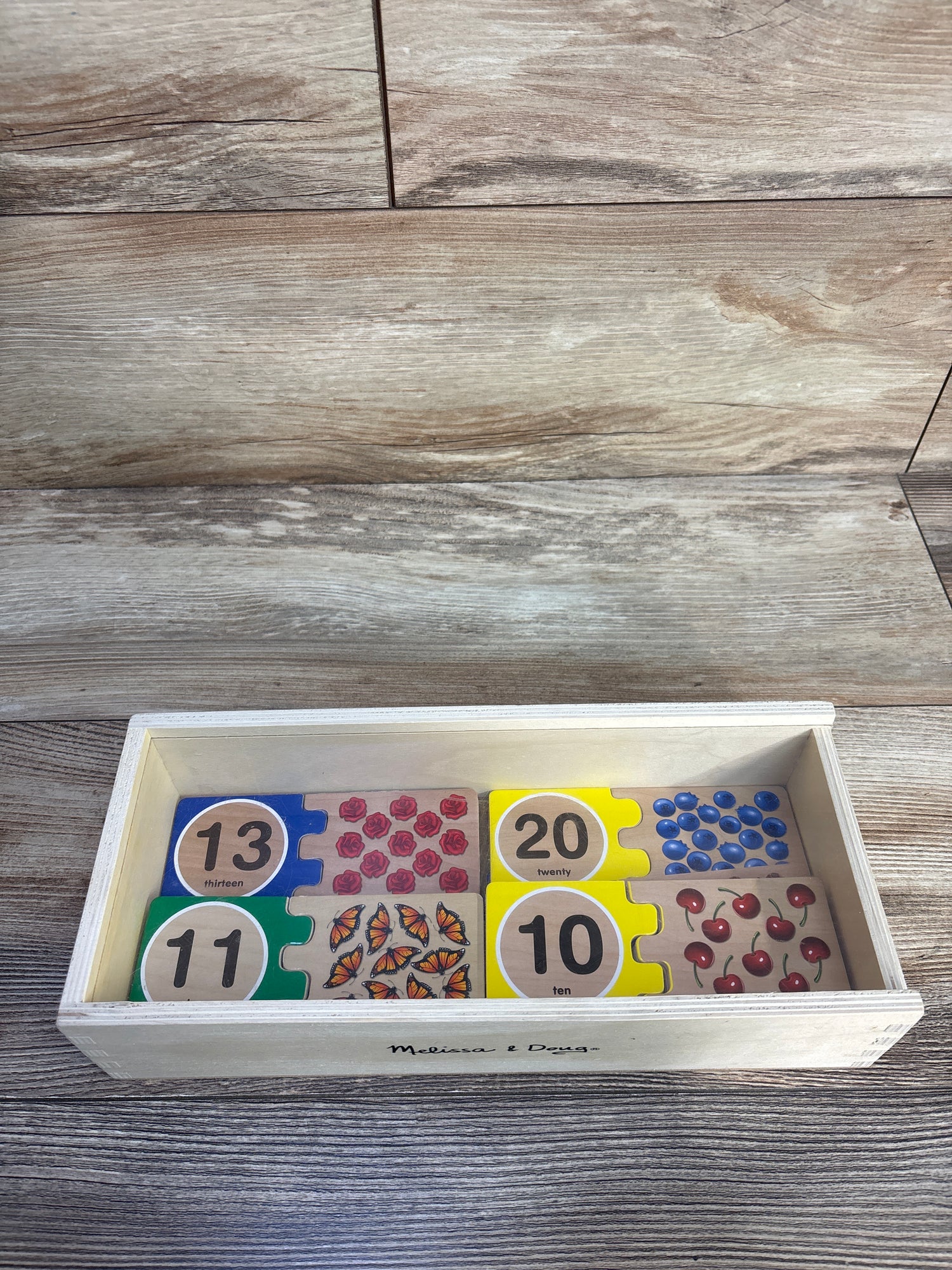 Melissa & Doug Self-Correcting Wooden Number Puzzles With Storage Box