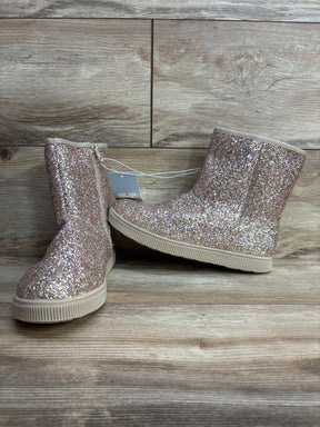 Sparkly glitter kids boots with side zippers, displayed on a wooden background