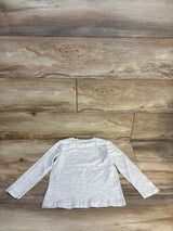Gray long sleeve kids shirt on wood floor, kids clothing resale