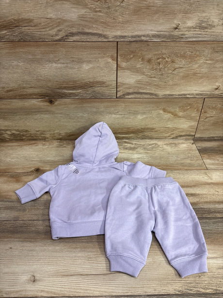 Baby Gap 2-piece lilac zip-up hooded jacket and joggers set for 0-3 months on a wood background
