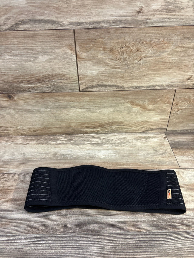 Flat-lay of AZMed maternity back support band in black showing breathable mesh center and adjustable Velcro straps on wood floor background