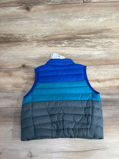 Children's sleeveless puffer vest in blue, teal, and gray colors on wooden surface