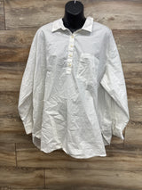 White long sleeve button-up children's shirt with chest pocket, displayed on mannequin