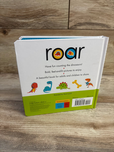 Back of Roar board book showing title Roar, line Have fun counting the dinosaurs, and small dinosaur illustrations on wood