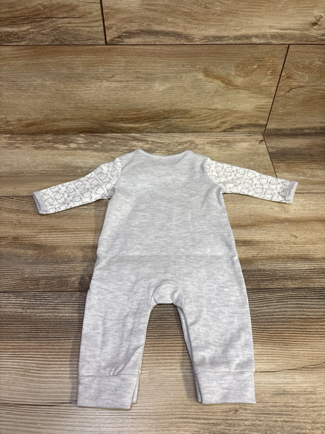 Flat lay of gray Starting Out Sleeper in newborn size showcasing patterned long sleeves on a wood-grain background