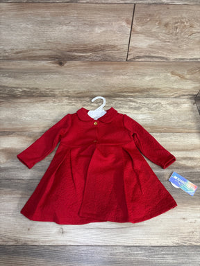 Red long-sleeve textured baby dress with collar and gold buttons on wooden floor, children's clothing