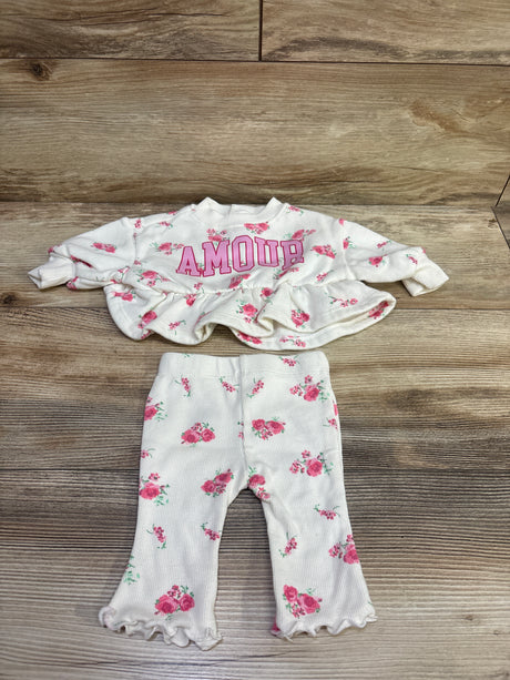 Flat lay of ivory Grayson Mini 2pc sweatshirt and joggers set showcasing floral print, ruffled hems, and AMOUR text