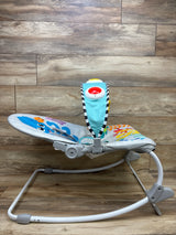 Side view of Baby Einstein Ocean Explorers Opus rocker showing ocean-themed seat on wood flooring