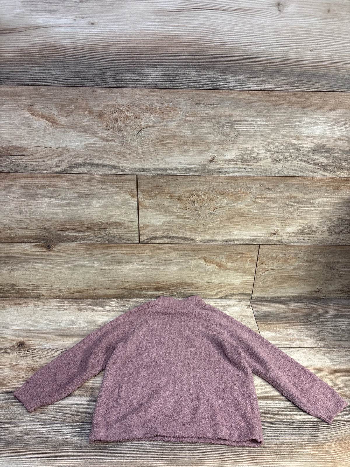 Modern Moments fuzzy knit sweater in mauve for toddlers, size 3T, on a wood background.