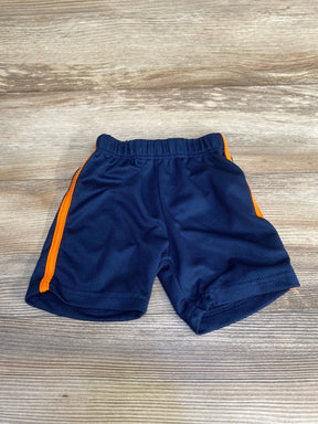 Top-down view of Alex and Jack navy pull-on shorts with orange side stripes and elastic waistband on wood background