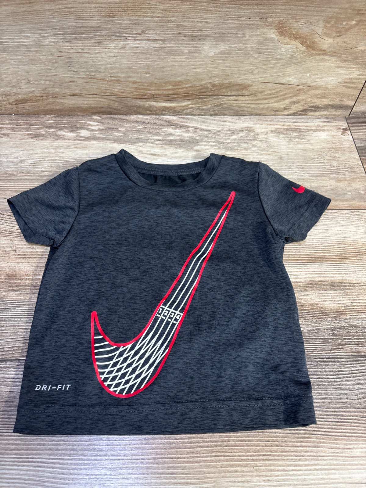 Grey Nike Dri-Fit toddler shirt size 2T with a red and white graphic swoosh logo