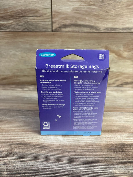 Front view of Lansinoh 50-count 6 oz breastmilk storage bags box showing headline and double zipper on wood background