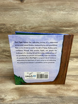 Back cover of children's book First Flight with story synopsis, barcode, and Launch39 Books logo on wood surface