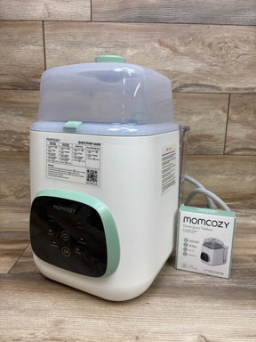 Three-quarter view of Momcozy KleanPal Pro Baby Bottle Washer, Sterilizer and Dryer with clear lid on wood paneling