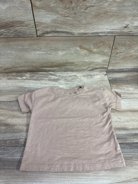 Beige Just One You short sleeve toddler shirt size 24m on a wood background