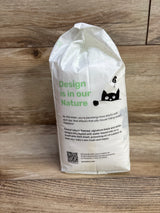 Front of Parasol Clear + Dry Bye Bye Rash! diaper pack (size 2, 12ct) showing green 'Design is in our Nature' text and black cat illustration on wood background