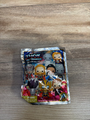 Thor Love and Thunder collector bag clip mystery pack on wood background