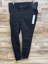 Front view of black Isabel maternity side-panel skinny jeans showing slim fit and elastic side panel on wood floor background