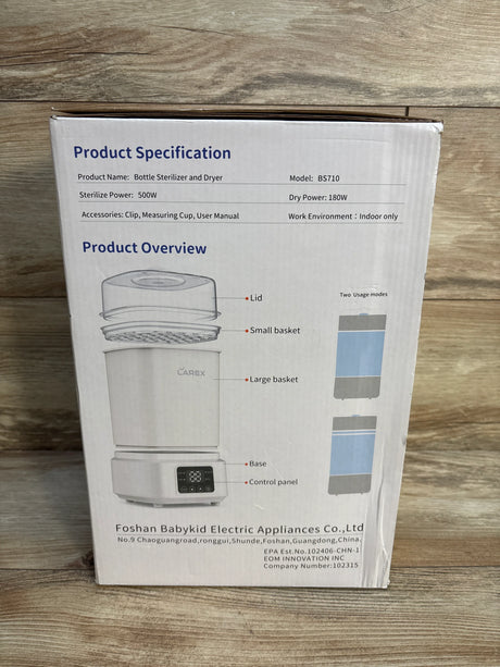 Box of baby bottle sterilizer and dryer with product specifications and diagram on wood background.