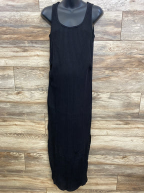 Front view of black Gap maternity ribbed maxi dress with scoop neckline, tank straps and vertical ribbing on wood background