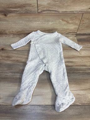 Light gray baby footed sleeper with animal face booties, long sleeves, on wood floor