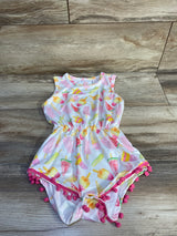 Flat lay of white toddler romper with popsicle and watermelon print, elastic waist, and pink pom-pom trim on wood