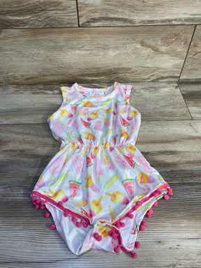 Flat lay of white toddler romper with popsicle and watermelon print, elastic waist, and pink pom-pom trim on wood