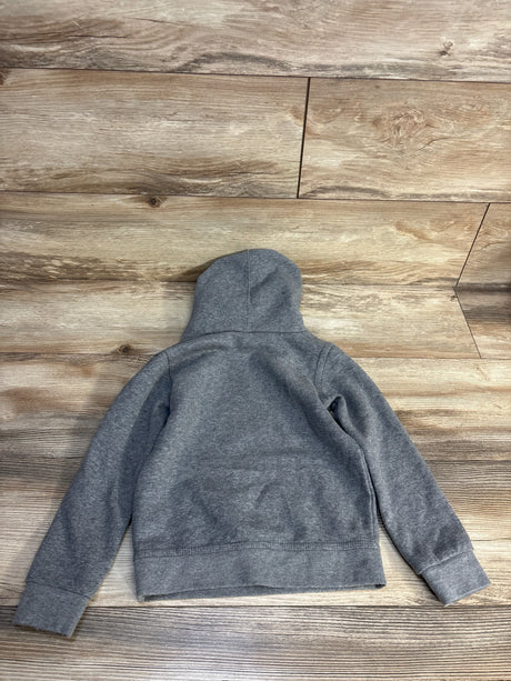 Gray kids hoodie laid flat on wood floor, cozy children's clothing for resale
