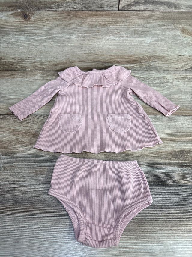 Pink ribbed baby girl dress set with ruffle collar and matching bloomers on wood floor