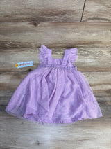 Light purple toddler dress with ruffle sleeves on wood background, gently used kids clothing