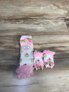 Pink cupcake baby leg warmers and matching socks with bows on wooden surface