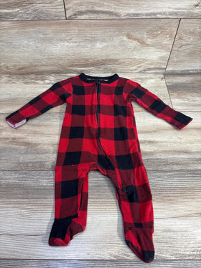 Red and black plaid baby sleeper with zipper on wooden floor