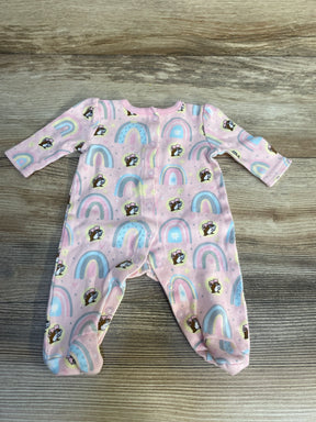 Pink baby sleeper with rainbow and puppy print, long sleeves, snap closure, laid flat on wood
