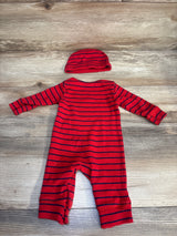 Red and navy striped baby romper with matching hat on wood background
