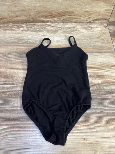 Front view of More Than Magic black leotard in size 4T showcasing crossed shoulder straps on a wood-grain background