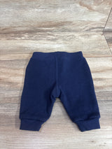 Flat lay of navy Ralph Lauren baby joggers (3 months) showing ribbed cuffs and elastic waistband on wood background