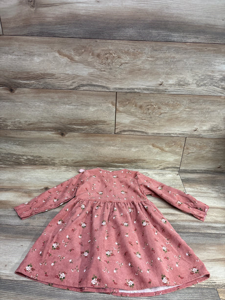 Front view of Shein pink floral long-sleeve button-front dress in size 3-4T, laid flat on wood